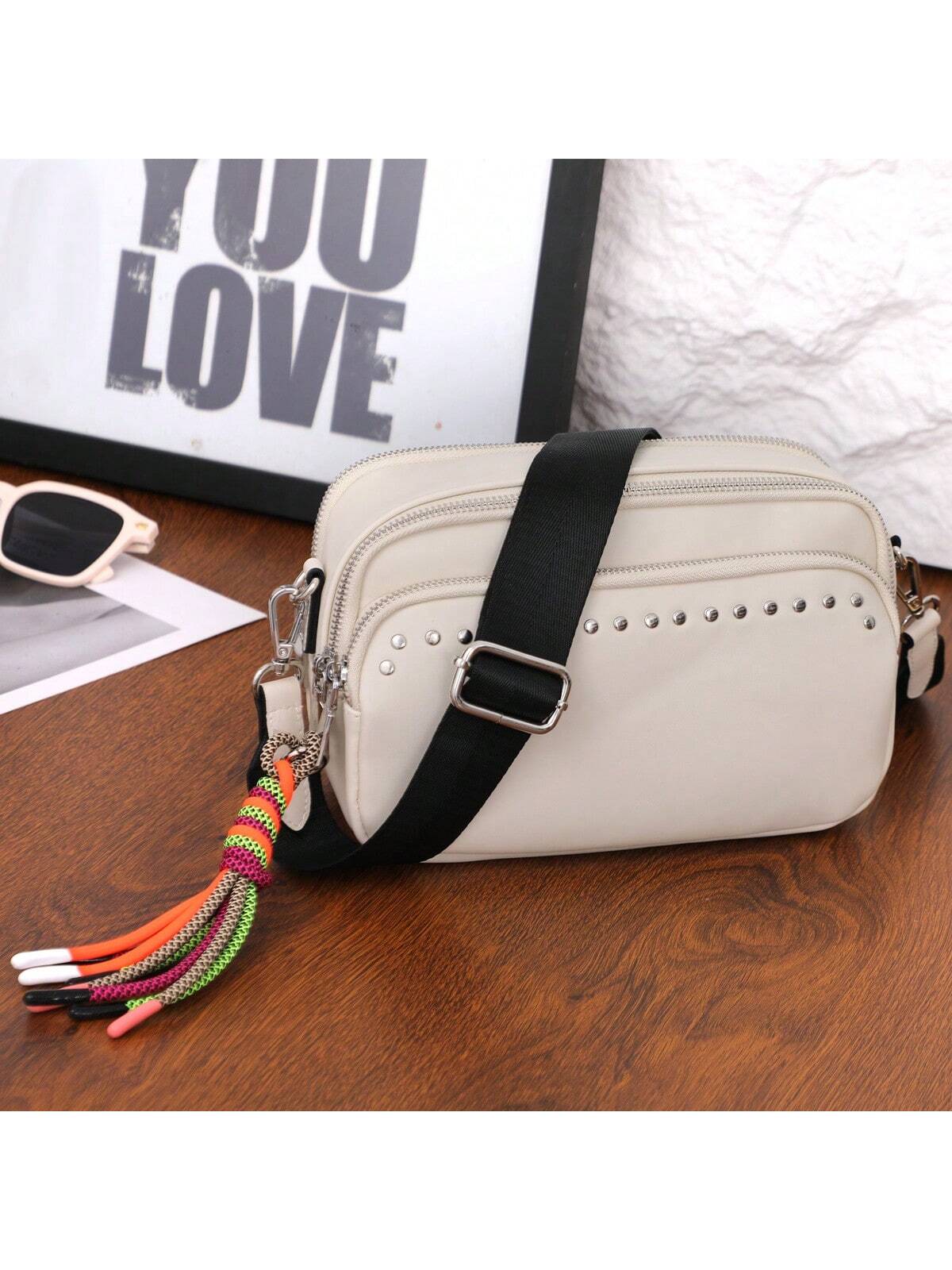 Women Small Crossbody Bag Beige With Multiple Pockets Trendy Tassel Compact Organized Square Purse Black With Wide Comfortable Nylon Guitar Strap