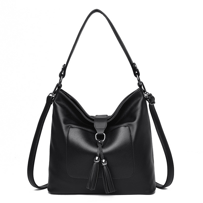 Large women hobo bag with tassel decoration and detachable long strap in pu leather