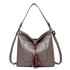 Large women hobo bag with tassel decoration and detachable long strap in pu leather