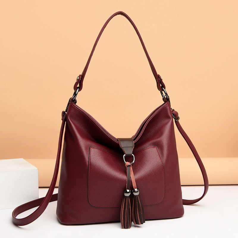 Large women hobo bag with tassel decoration and detachable long strap in pu leather